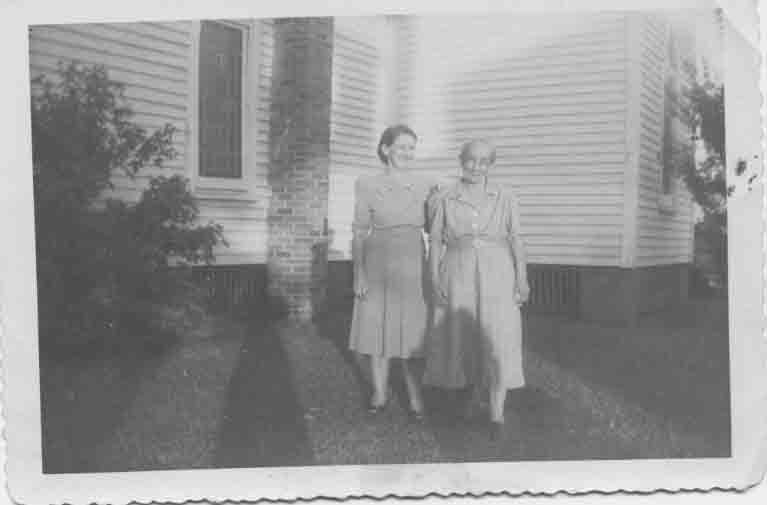 This photo is of my great-grandmother Malinda Bell Leonard Carter and an unknown woman taken in the yard of Grandma Carter's home in Crystal Springs about 1940.